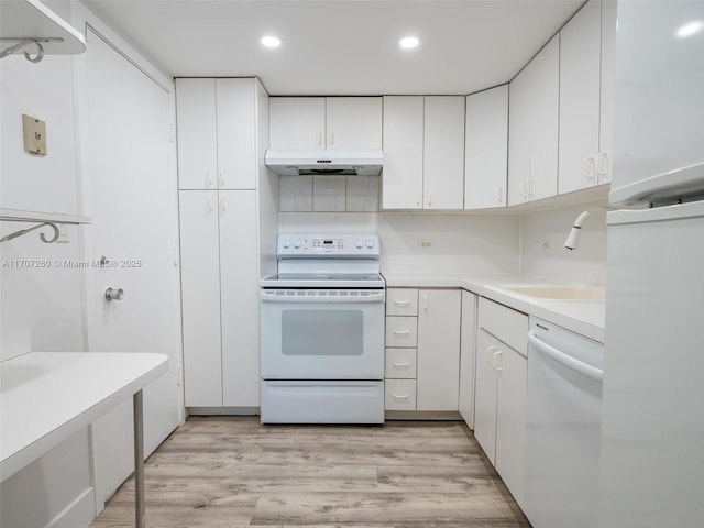 kitchen featuring sink, white cabinets, white appliances, and light hardwood / wood-style flooring