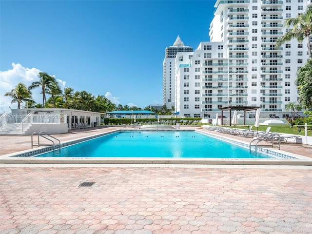 view of pool featuring a pergola and a patio area