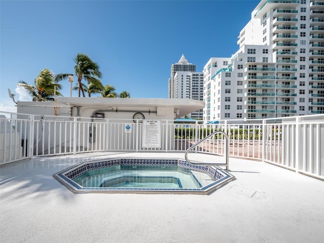 view of swimming pool featuring a community hot tub