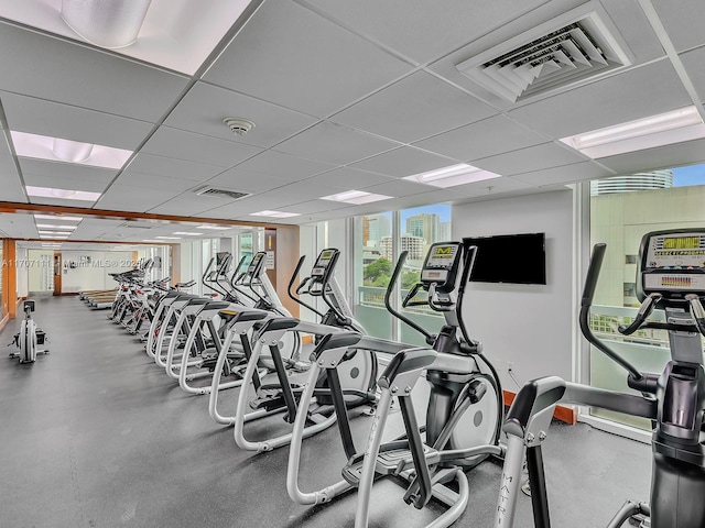 exercise room featuring a paneled ceiling