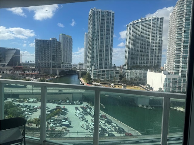 balcony featuring a water view