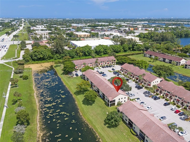 drone / aerial view with a water view