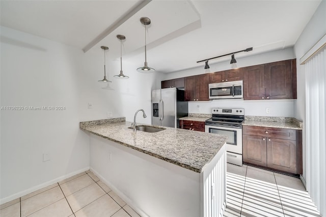 kitchen with pendant lighting, sink, appliances with stainless steel finishes, light tile patterned flooring, and kitchen peninsula