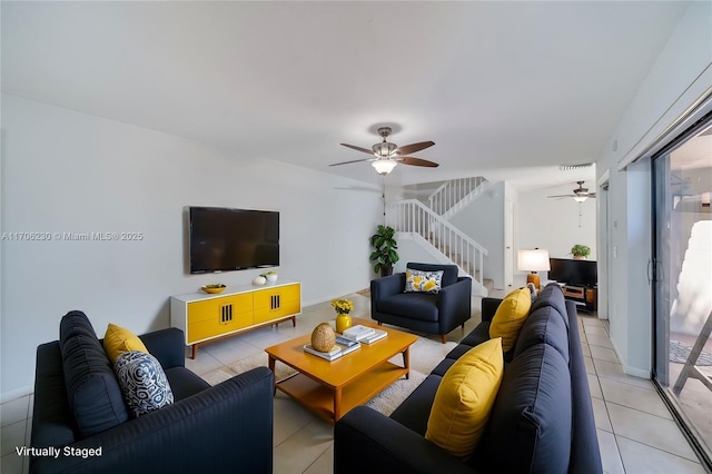 tiled living room with ceiling fan