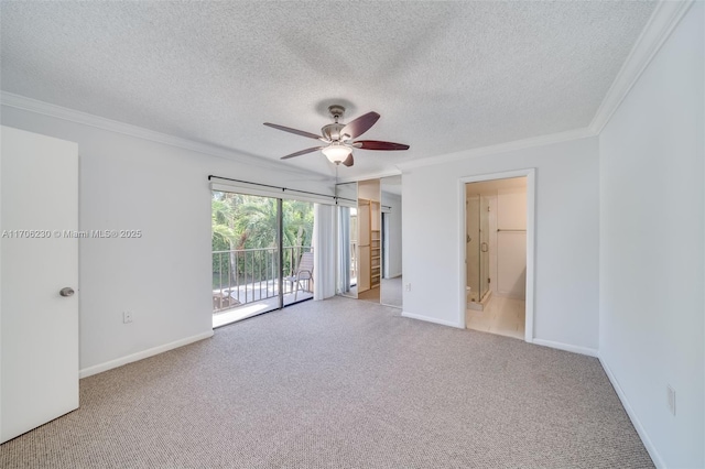 empty room featuring crown molding, light carpet, a textured ceiling, and ceiling fan