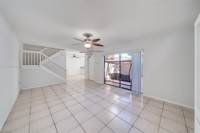 spare room featuring ceiling fan and light tile patterned flooring