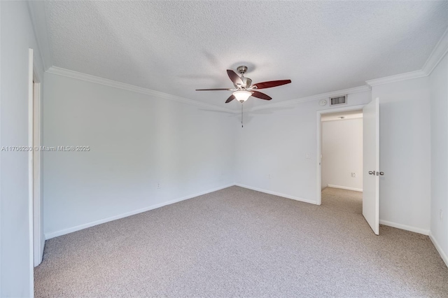 carpeted empty room with crown molding, a textured ceiling, and ceiling fan