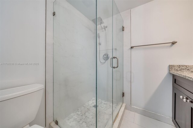 bathroom featuring ceiling fan, tile patterned flooring, vanity, and toilet