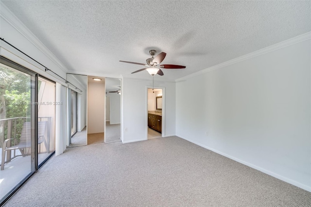 unfurnished bedroom with ceiling fan, ornamental molding, ensuite bathroom, and light carpet