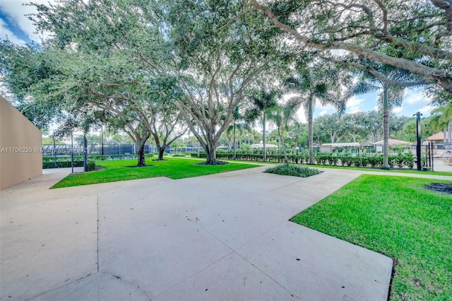 view of home's community with a yard