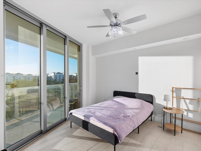 bedroom featuring access to exterior and ceiling fan