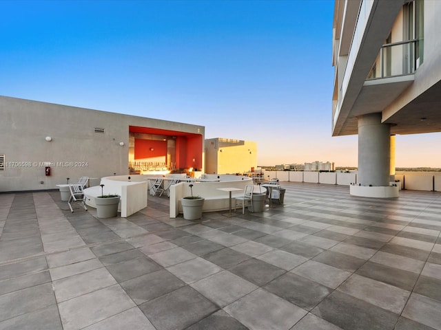 view of patio terrace at dusk