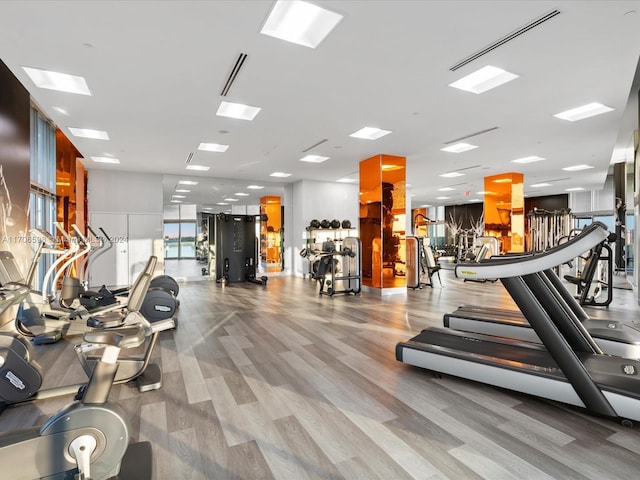 workout area with light wood-type flooring