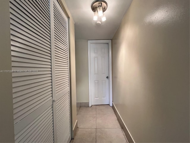 hallway featuring light tile patterned floors