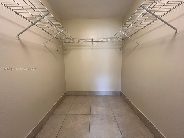 3700 NW 21st St Unit 304, Lauderdale Lakes, FL 33311 - walk in closet with light tile patterned floors