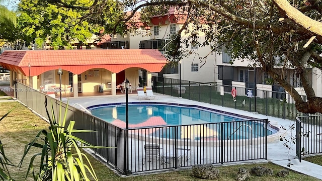 view of swimming pool featuring a patio