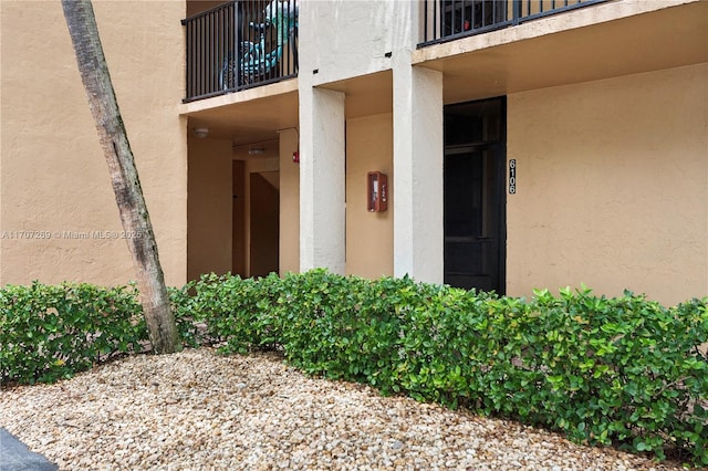 property entrance with a balcony