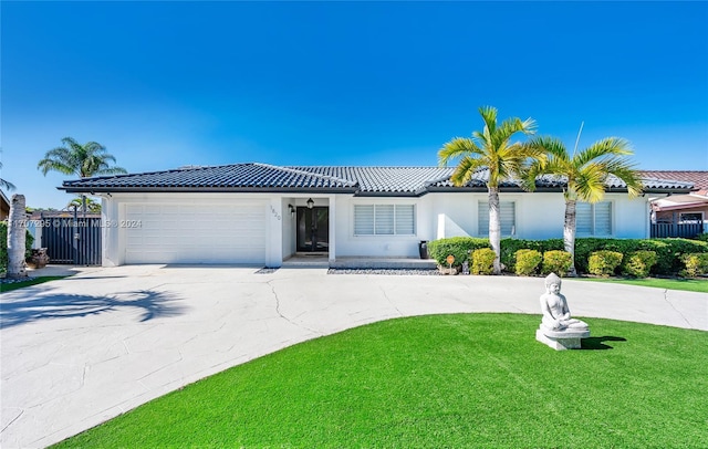 view of front facade with a front lawn and a garage