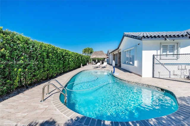 view of pool featuring a patio