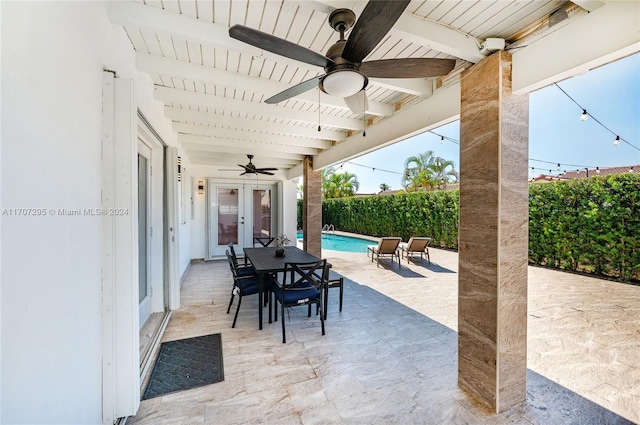 view of patio / terrace with a fenced in pool and french doors