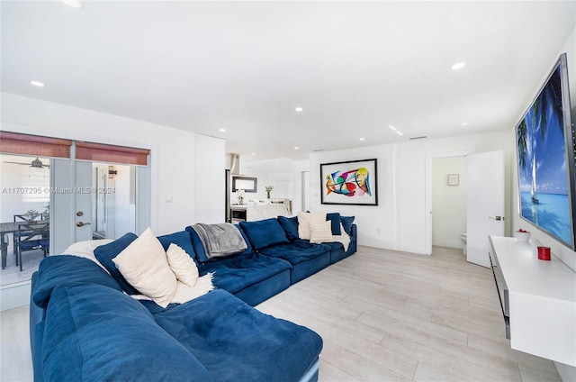 living room with light hardwood / wood-style flooring