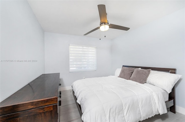 bedroom featuring hardwood / wood-style flooring and ceiling fan