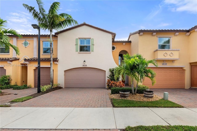 mediterranean / spanish-style house featuring a garage