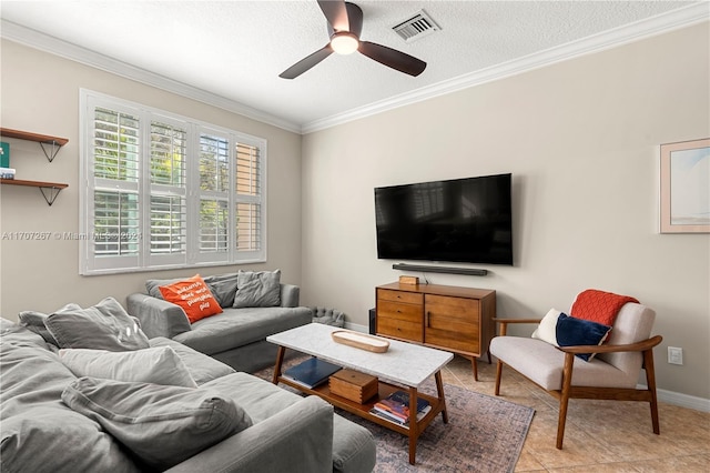 living room featuring ceiling fan, light tile patterned floors, a textured ceiling, and ornamental molding