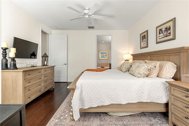 bedroom featuring ceiling fan and dark wood-type flooring