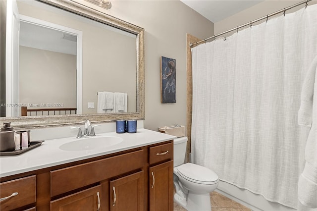 full bathroom with tile patterned flooring, shower / bath combination with curtain, vanity, and toilet