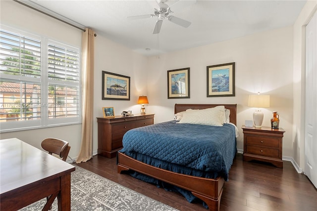 bedroom with ceiling fan and dark wood-type flooring