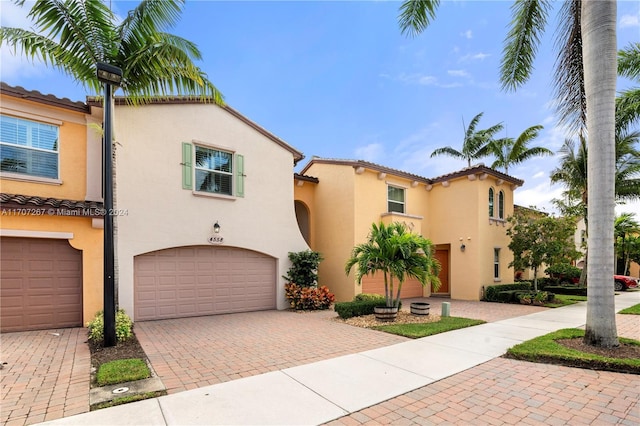 mediterranean / spanish-style house featuring a garage