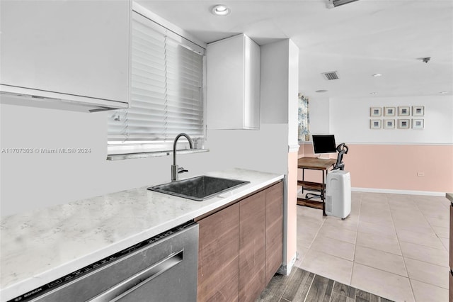 kitchen with dishwasher, light wood-type flooring, and sink