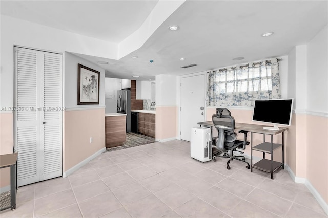 office area with light tile patterned floors