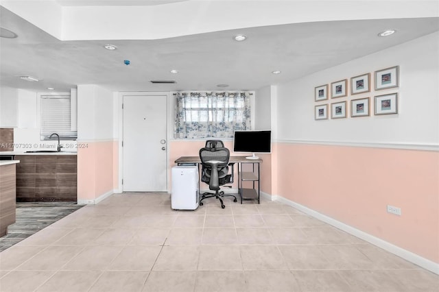 office area featuring light tile patterned floors and sink