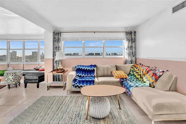 tiled living room featuring a healthy amount of sunlight