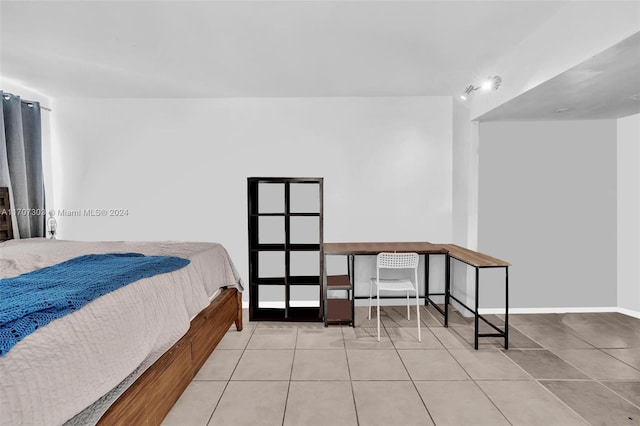 bedroom featuring light tile patterned floors