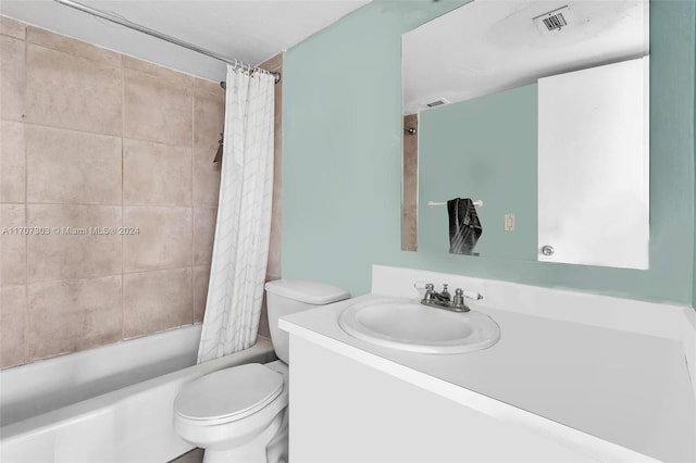 full bathroom with vanity, toilet, and shower / bathtub combination with curtain