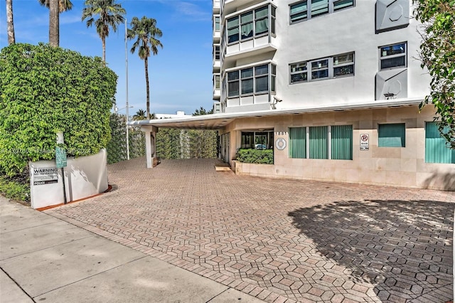 exterior space with a carport