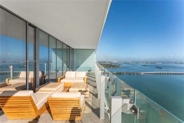 balcony featuring a water view