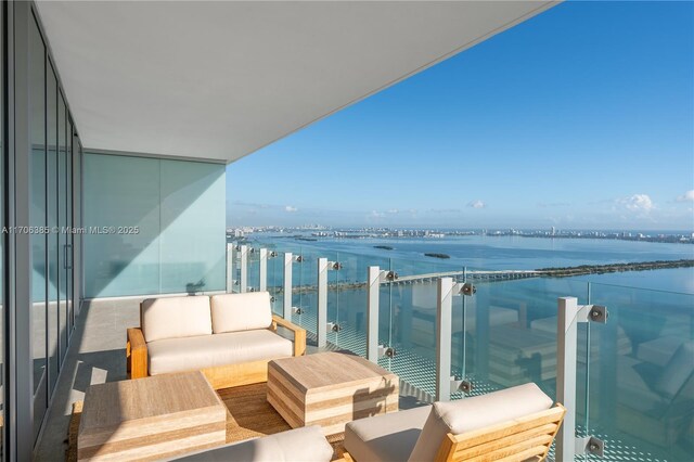 living room featuring a wall of windows