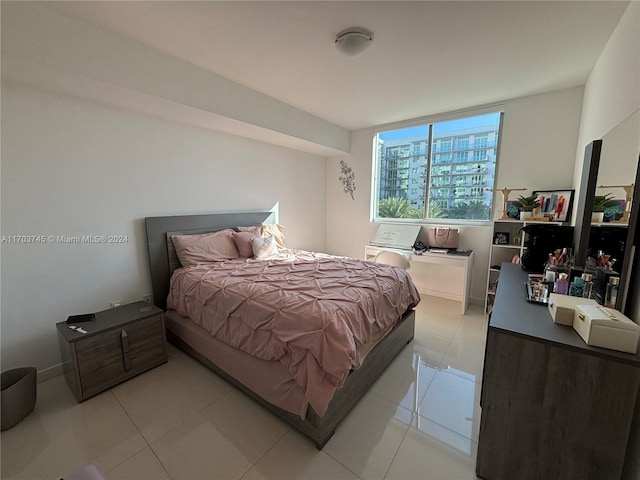 bedroom featuring light tile patterned flooring