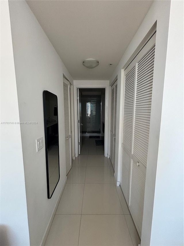 hallway with light tile patterned floors