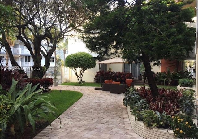 10210 Collins Ave Unit 306, Bal Harbour, FL 33154 - view of yard with a patio area and an outdoor hangout area