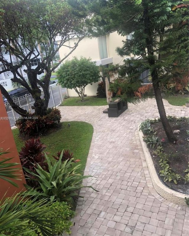 10210 Collins Ave Unit 306, Bal Harbour, FL 33154 - view of yard with a patio area