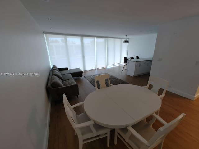 10210 Collins Ave Unit 306, Bal Harbour, FL 33154 - dining room featuring wood finished floors
