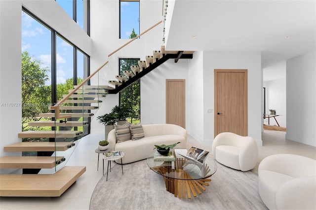 living room featuring a towering ceiling