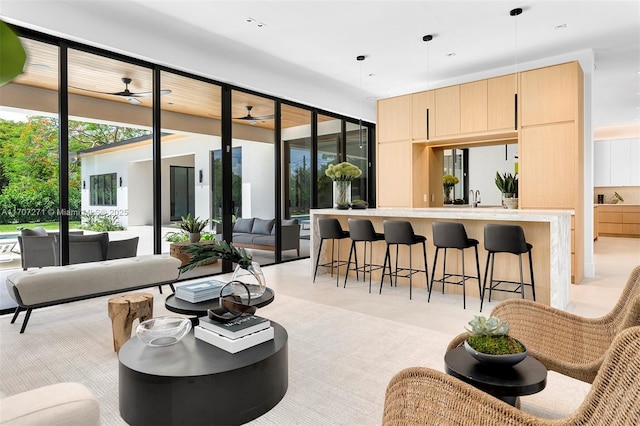 interior space featuring ceiling fan and sink