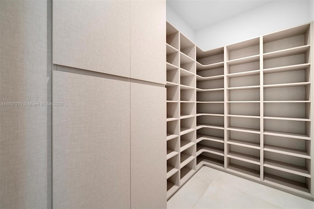 spacious closet featuring tile patterned floors