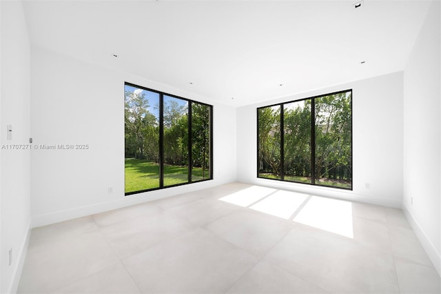 unfurnished room with a wealth of natural light